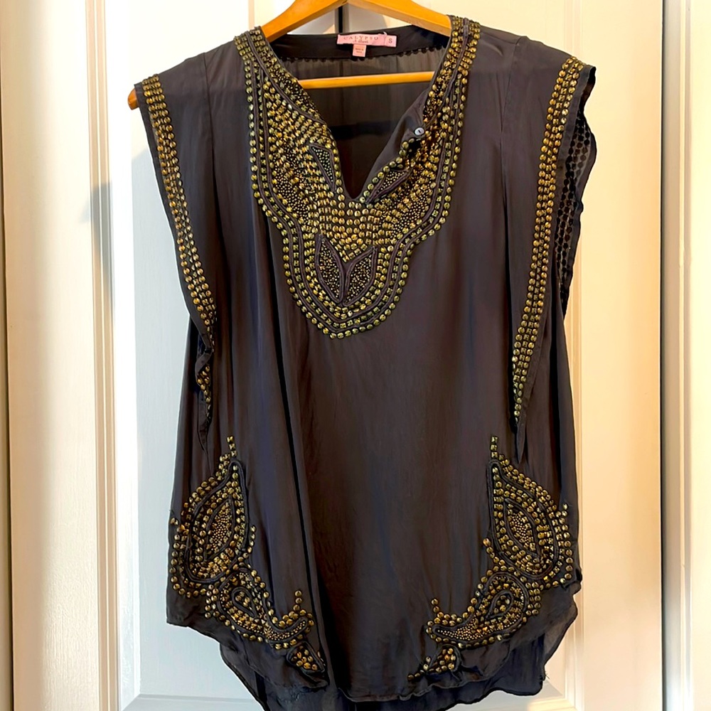 Calypso grey silk top with brass detailing. Cap sleeves.